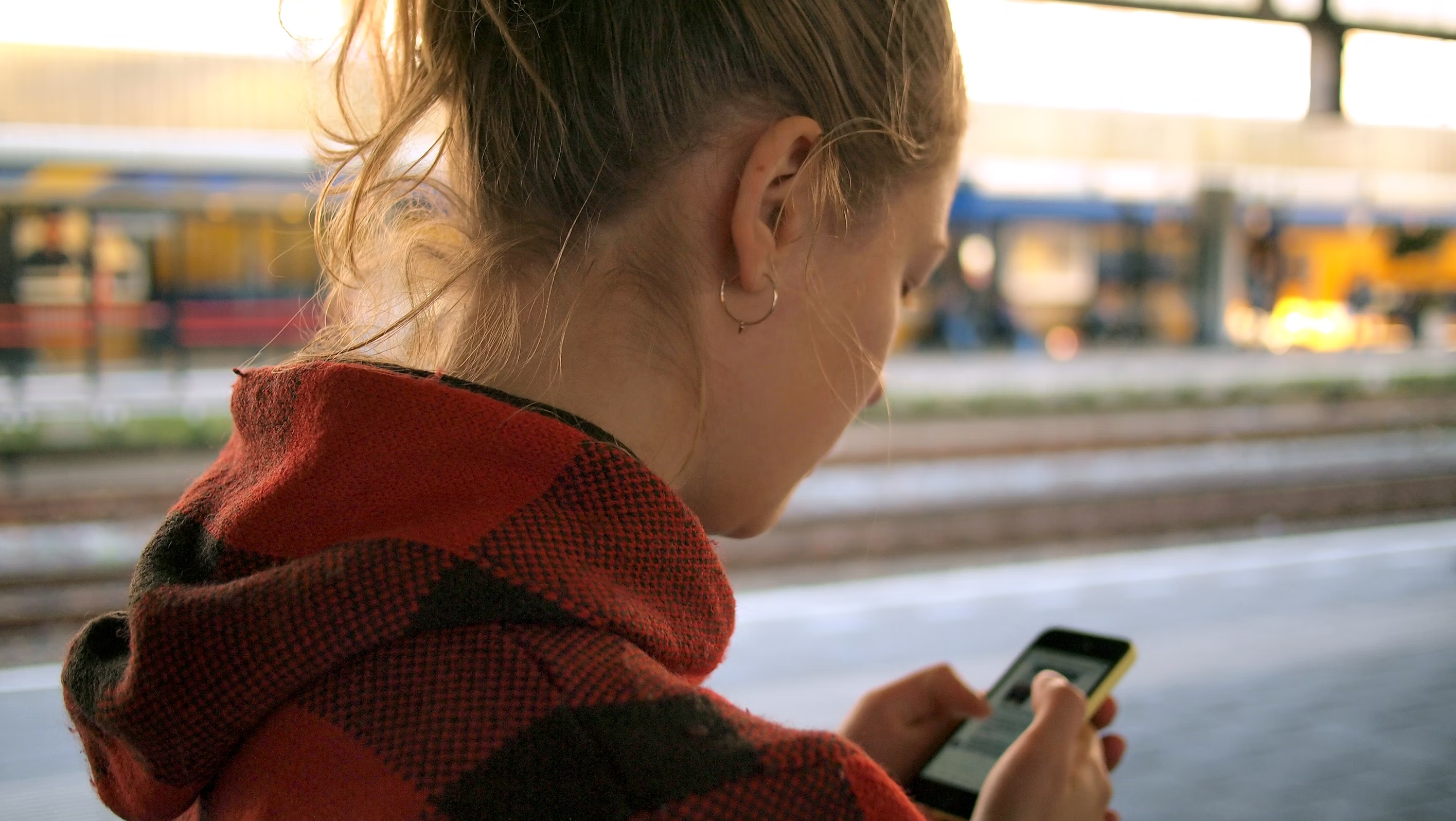 Person interacting with iPhone